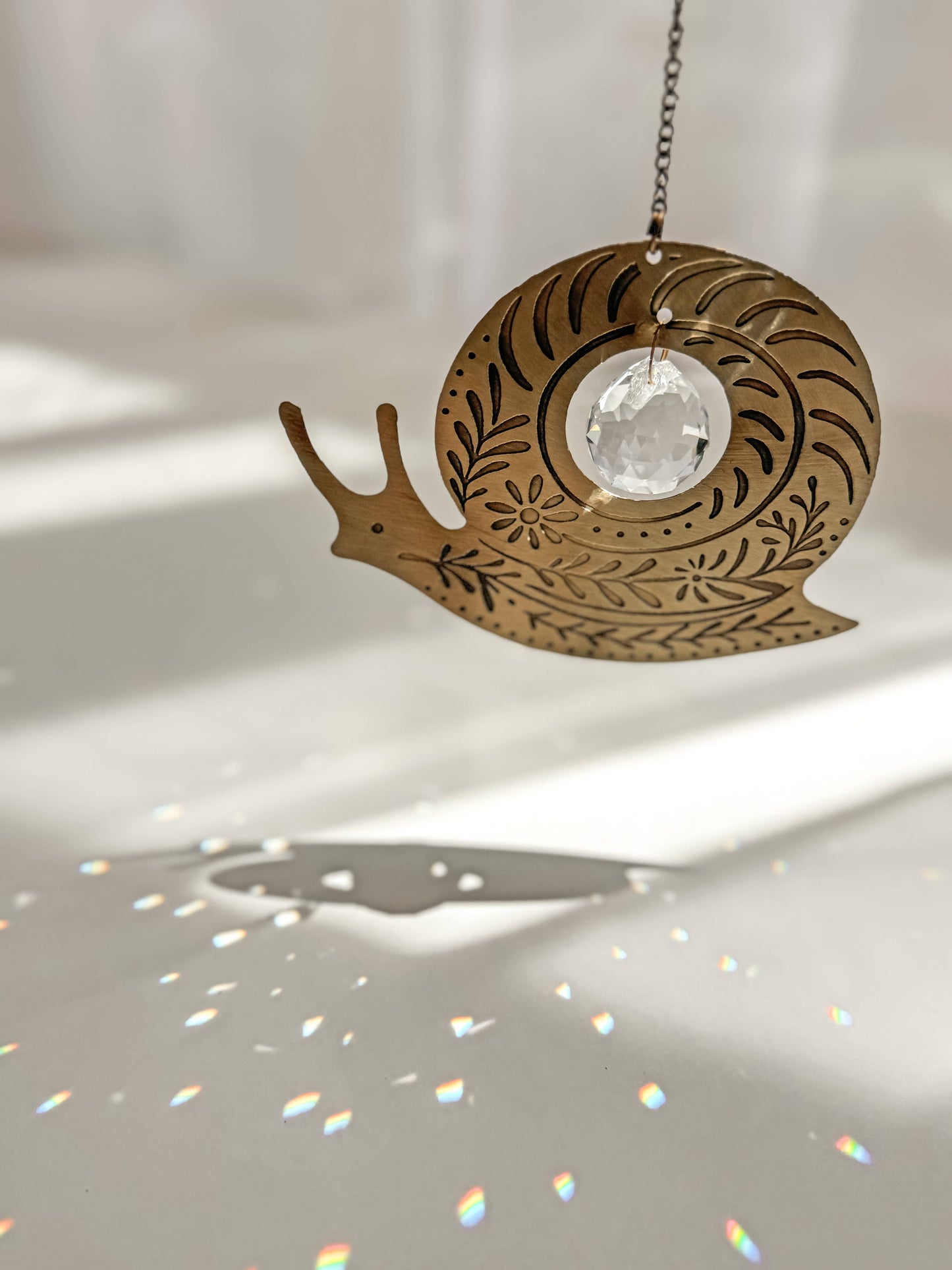 Surya Snail Engraved Brass Suncatcher