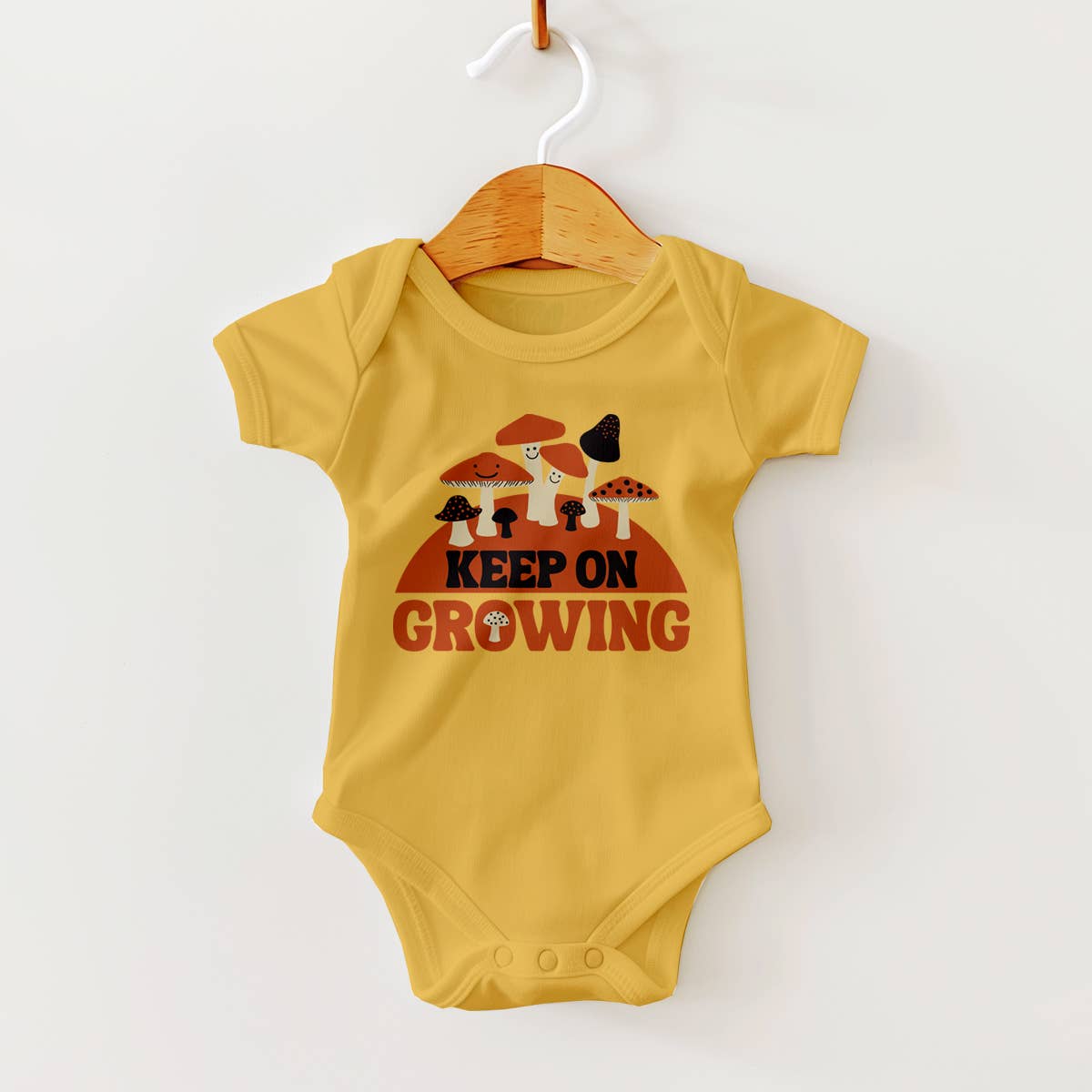 Mushrooms Groovy Design on Mustard Yellow Baby Bodysuit